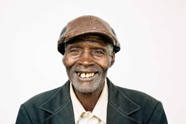 Portrait of Damien, a Burundian coffee farmer, from the series "Before + Now".