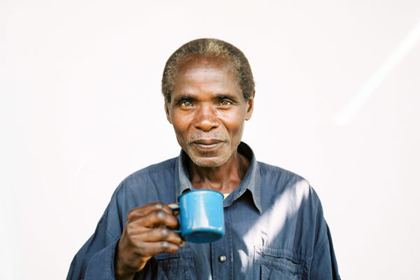 Portrait of Appolinaire, a Burundian coffee farmer, from the series "Before + Now".